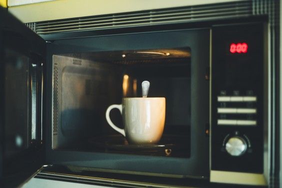 Mug and spoon in a microwave